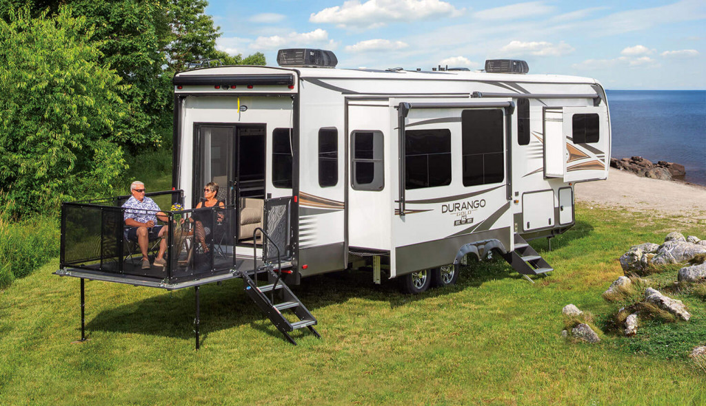 2022-KZ-RV-Durango-Gold-G358RPQ-Fifth-Wheel-with-Couple-at-Beach-Campsite